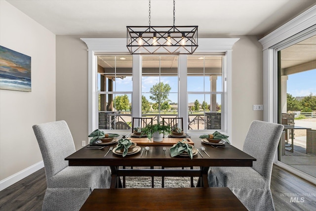 12975 Silversage Dr, Nampa, ID 83686 - dining area with dark wood finished floors and baseboards