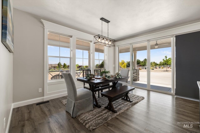 12975 Silversage Dr, Nampa, ID 83686 - dining area with plenty of natural light and dark wood-style floors