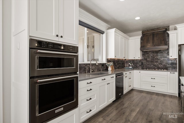 12975 Silversage Dr, Nampa, ID 83686 - kitchen featuring stainless steel dishwasher, custom exhaust hood, white cabinetry, decorative backsplash, and recessed lighting