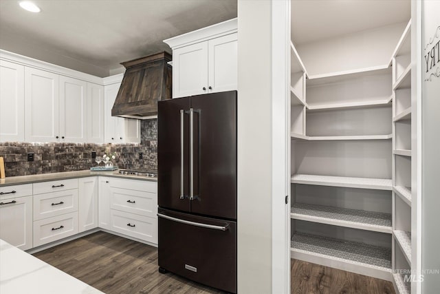 12975 Silversage Dr, Nampa, ID 83686 - kitchen with high end fridge, premium range hood, dark wood-style floors, white cabinetry, and recessed lighting
