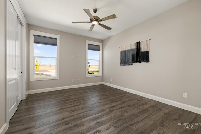 12975 Silversage Dr, Nampa, ID 83686 - spare room featuring dark wood-style flooring and ceiling fan