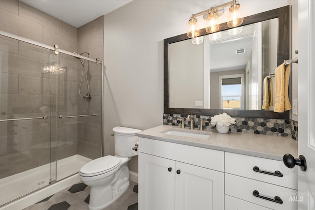 12975 Silversage Dr, Nampa, ID 83686 - full bath featuring vanity, a stall shower, tile patterned floors, and tasteful backsplash