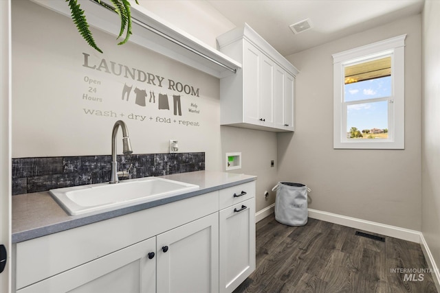 12975 Silversage Dr, Nampa, ID 83686 - laundry room featuring cabinet space, electric dryer hookup, dark wood-style floors, and washer hookup