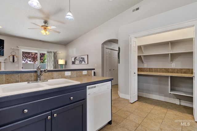 1326 N Alvey, Meridian, ID 83642 - kitchen featuring dishwasher, a sink, arched walkways, ceiling fan, and light tile patterned floors