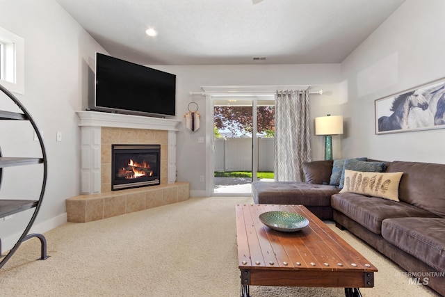 1326 N Alvey, Meridian, ID 83642 - living area featuring carpet flooring, a tile fireplace, baseboards, and recessed lighting