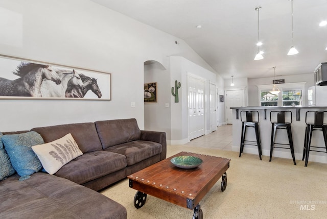1326 N Alvey, Meridian, ID 83642 - living room with lofted ceiling, baseboards, and light carpet