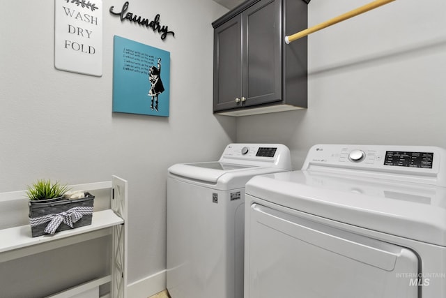 1326 N Alvey, Meridian, ID 83642 - washroom featuring washing machine and dryer, cabinet space, and baseboards