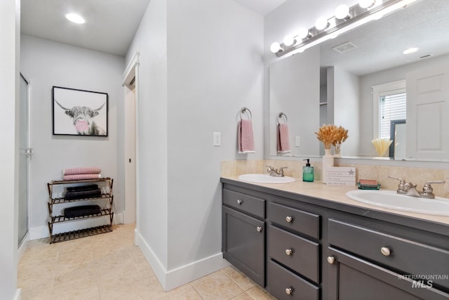 1326 N Alvey, Meridian, ID 83642 - bathroom featuring double vanity, tile patterned flooring, and baseboards