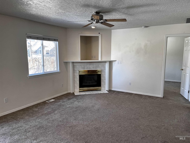 unfurnished living room featuring carpet floors, visible vents, a fireplace, and baseboards