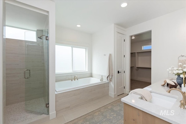 3064 N Wingspan Way, Eagle, ID 83616 - bathroom with a stall shower, a wealth of natural light, a garden tub, and recessed lighting