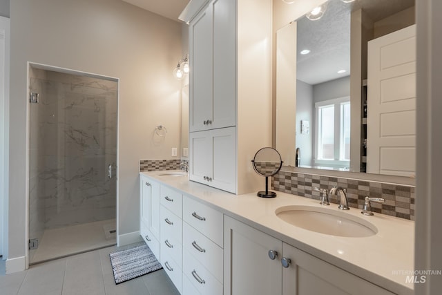 2522 N Foudy Ave, Eagle, ID 83616 - bathroom featuring decorative backsplash, double vanity, a marble finish shower, and tile patterned flooring
