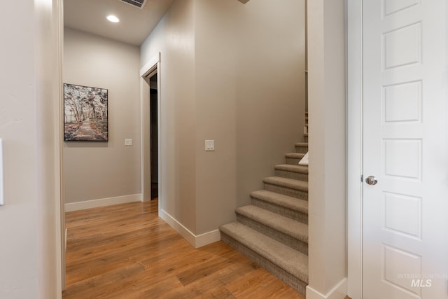 2522 N Foudy Ave, Eagle, ID 83616 - corridor with baseboards, light wood-style flooring, recessed lighting, and stairway