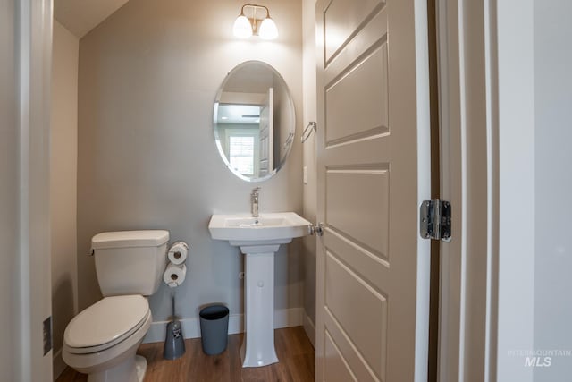 2522 N Foudy Ave, Eagle, ID 83616 - bathroom with toilet, wood finished floors, baseboards, and a sink