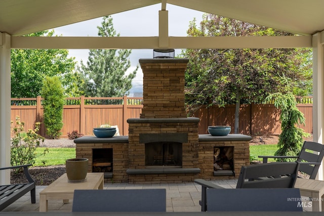 2522 N Foudy Ave, Eagle, ID 83616 - view of patio featuring an outdoor stone fireplace