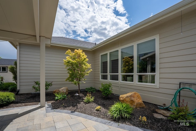 2522 N Foudy Ave, Eagle, ID 83616 - view of side of property with a patio area