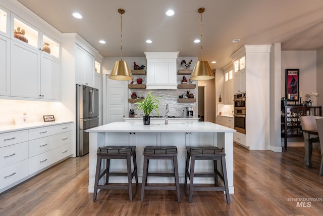 2522 N Foudy Ave, Eagle, ID 83616 - kitchen featuring stainless steel appliances, open shelves, light countertops, tasteful backsplash, and a breakfast bar