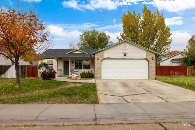 ranch-style home featuring a front yard, a garage, and a porch