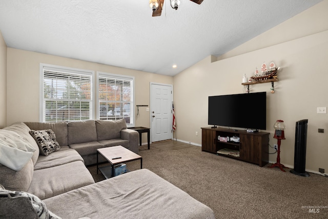 carpeted living room with ceiling fan, a textured ceiling, and lofted ceiling