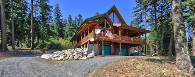 view of front facade featuring a garage and a deck