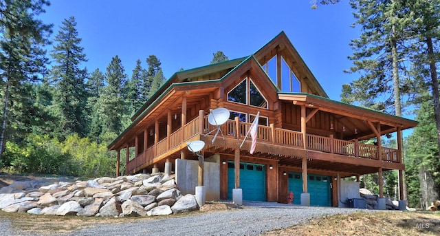 view of front of property featuring a garage and a wooden deck