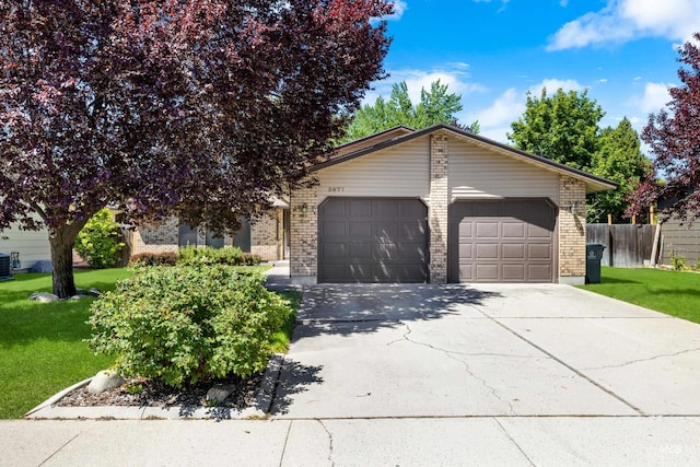 3877 S W Point Pl, Boise, ID 83706 - view of front of home featuring brick siding, an attached garage, concrete driveway, and cooling unit