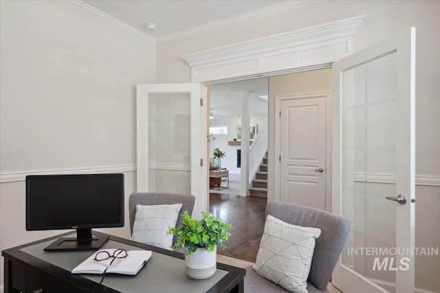 office with french doors, ornamental molding, and wood finished floors