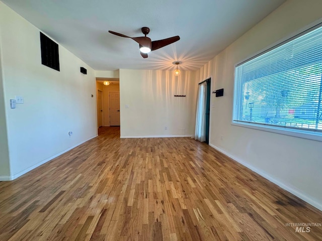 23212NDAVEN 2nd Ave N, Lewiston, ID 83501 - spare room featuring baseboards, wood finished floors, a ceiling fan, and visible vents