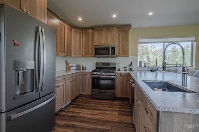 13005 Lake Shore Dr, Nampa, ID 83686 - kitchen with dark wood finished floors, recessed lighting, appliances with stainless steel finishes, a sink, and backsplash