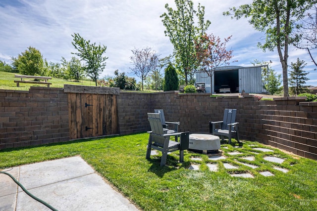 13005 Lake Shore Dr, Nampa, ID 83686 - view of yard with a fire pit, a fenced backyard, and a gate