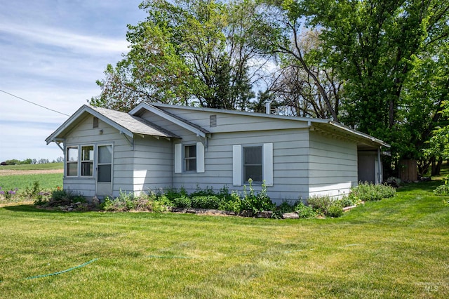 13005 Lake Shore Dr, Nampa, ID 83686 - view of side of property with a lawn