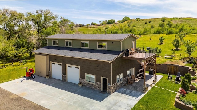 13005 Lake Shore Dr, Nampa, ID 83686 - exterior space with a front yard, an attached garage, stone siding, stairs, and driveway