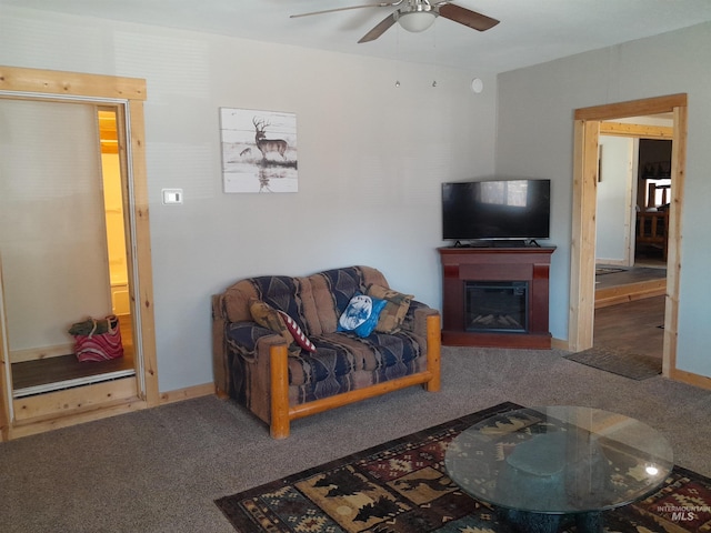 carpeted living room with ceiling fan