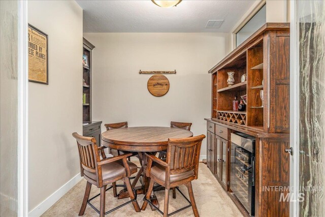 4595 N Tirso Ave, Meridian, ID 83646 - dining area featuring baseboards, visible vents, and light carpet