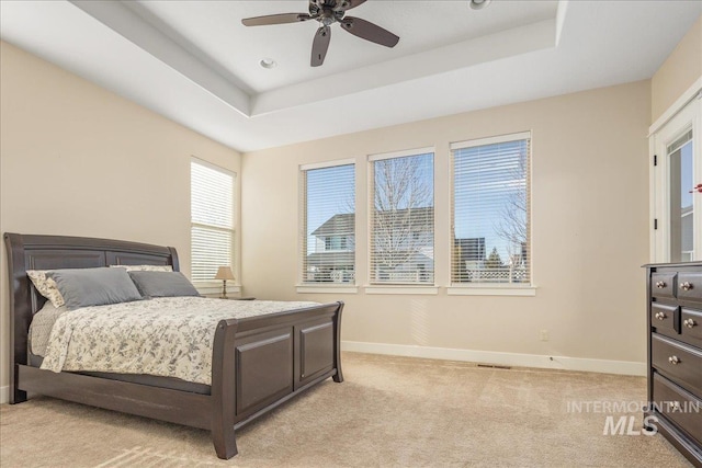 4595 N Tirso Ave, Meridian, ID 83646 - bedroom with a ceiling fan, visible vents, light colored carpet, baseboards, and a raised ceiling