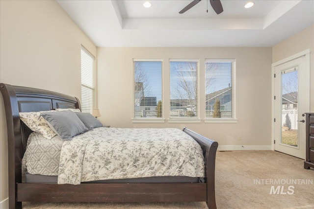 4595 N Tirso Ave, Meridian, ID 83646 - bedroom with baseboards, access to outside, a tray ceiling, and carpet flooring