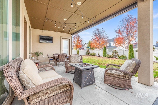 4595 N Tirso Ave, Meridian, ID 83646 - view of patio / terrace featuring a fenced backyard, an outdoor living space with a fire pit, and outdoor dining space