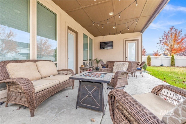 4595 N Tirso Ave, Meridian, ID 83646 - view of patio featuring fence and an outdoor living space with a fire pit