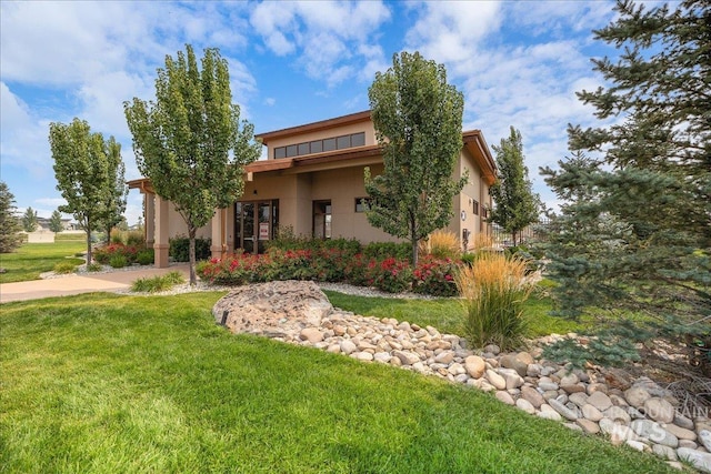 4595 N Tirso Ave, Meridian, ID 83646 - view of front facade with a front lawn and stucco siding