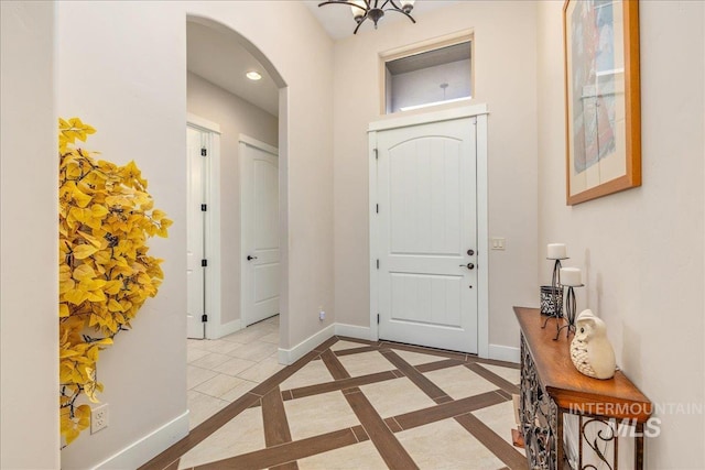 4595 N Tirso Ave, Meridian, ID 83646 - foyer with baseboards, arched walkways, and recessed lighting