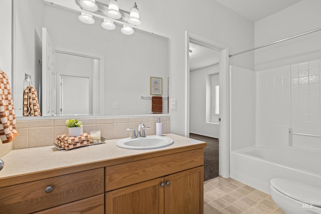 full bathroom featuring vanity,  shower combination, backsplash, and toilet