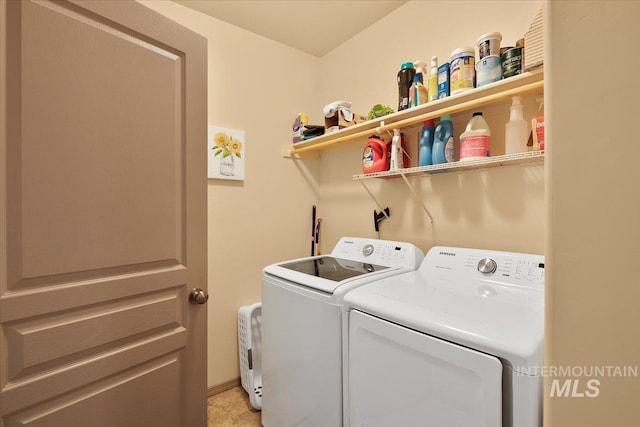 laundry area featuring washer and clothes dryer and laundry area