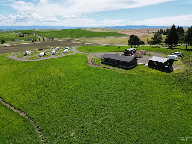 aerial view featuring a rural view and a mountain view