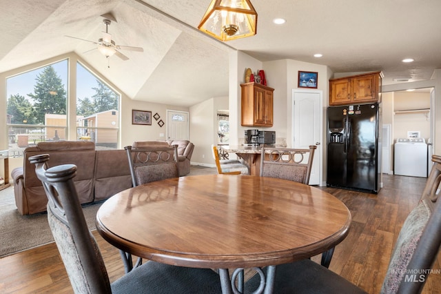 dining area featuring vaulted ceiling, recessed lighting, washer / dryer, and dark wood-style flooring