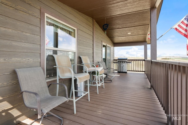 wooden terrace with grilling area