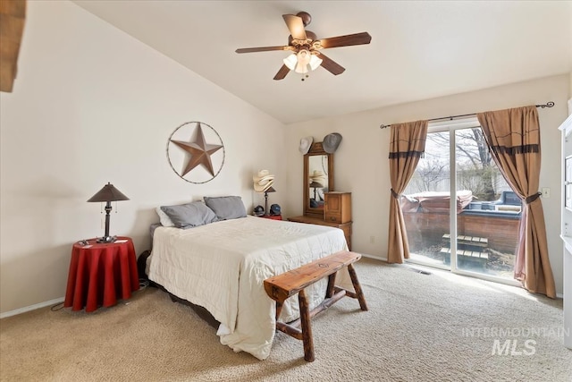 bedroom featuring access to exterior, baseboards, light colored carpet, vaulted ceiling, and a ceiling fan