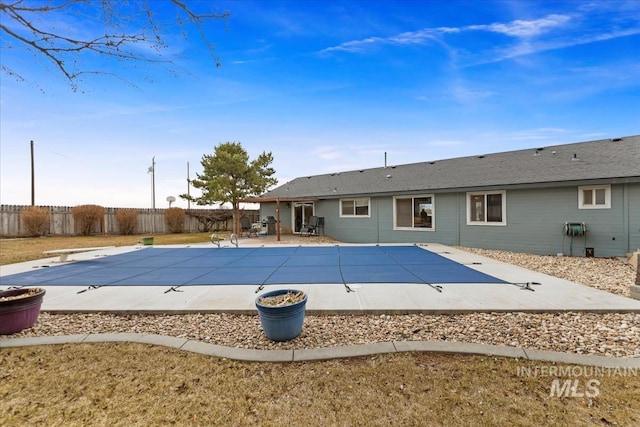 view of swimming pool featuring a fenced in pool, a patio, and a fenced backyard