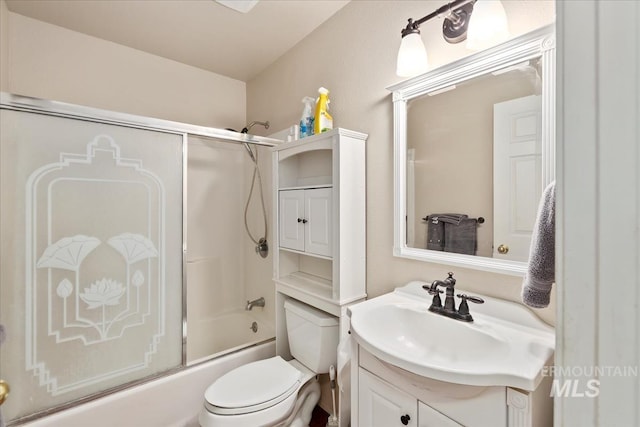 bathroom featuring vanity, toilet, and enclosed tub / shower combo