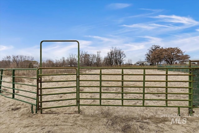 view of gate featuring a rural view