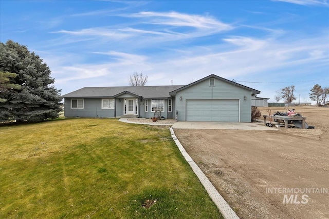 ranch-style house with a garage, driveway, and a front lawn