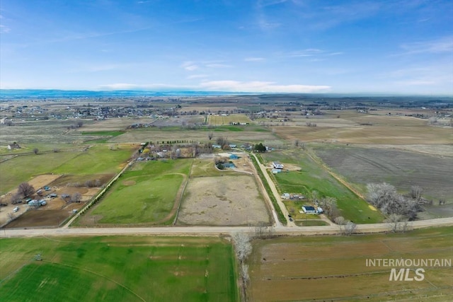 birds eye view of property featuring a rural view